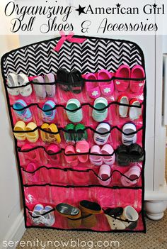 an organized closet with shoes and accessories on the bottom shelf for organizing american girl doll shoes & accessories