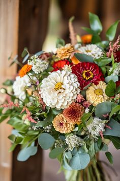 a bouquet of flowers sitting on top of a table