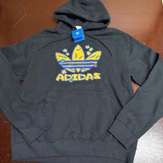 Adidas Originals Flower Puff Fleece Pullover Hoodie Yellow Black Men's Medium Or Xl Or 2x. Your Choice Adidas Black Sweatshirt For Sports Season, Adidas Fleece Hoodie For Streetwear, Black Adidas Logo Hoodie For Streetwear, Adidas Black Hoodie For Streetwear, Adidas Black Sweatshirt With Drawstring Hood, Black Adidas Fleece Hoodie, Adidas Urban Fleece Hoodie, Black Fleece Adidas Hoodie, Black Adidas Logo Fleece Hoodie