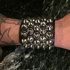 Staggered standard cone studded bracelet on black leather Battle Jackets, Hobie Brown, Studded Bracelet, Battle Jacket, Studded Belt, Grunge Punk, Leather Cuffs, Philadelphia Pa, Pinterest Board