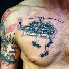 a man with a helicopter tattoo on his chest