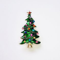 Festive green enamel and colorful rhinestone christmas tree brooch! Not intended for children ages 13 and under.   Also, for many items we can accommodate large orders, so please send us a message. Green Christmas Brooches For Gifts, Green Christmas Brooches As Gifts, Green Enamel Brooch Pin As Gift, Green Brooch Enamel Pin For Gift, Green Enamel Pin Brooch For Gift, Green Enamel Brooch As Gift, Green Enamel Pins, Jewelry Christmas, Christmas Gift Jewelry