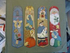 four christmas bookmarks are sitting on a table