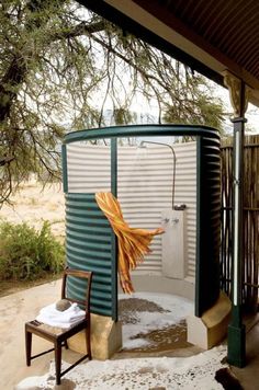 an outdoor shower in the middle of winter