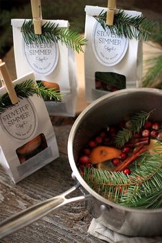 some food is in a pot on a table with small tags hanging from the handles