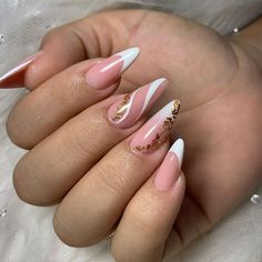 a woman's hand with some pink and white nails