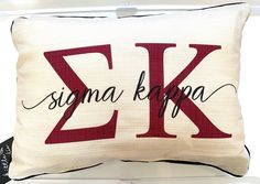 a pillow that has the letter k on it