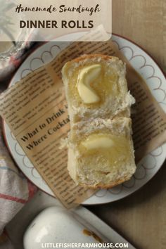 two pieces of bread on a plate with butter