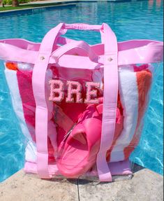 This clear tote can hold allll the essentials for your beach, lake or pool days! The oversized allows space for multiple towels, snacks, etc! Only fits up to 3 patches! Patches are NOT included in the price of the bag- they are $5 each! Dimensions: Pink Tote Beach Bag For Weekend, Pink Poolside Bags For Beach Season, Trendy Beach Bags With Clear Strap, Trendy Beach Bag With Clear Strap, Summer Pink Bags For Poolside, Pink Summer Beach Bag For Poolside, White Beach Bag For Vacation, Trendy Bags For Beach Season And Poolside, Trendy Bags For Poolside And Beach Season