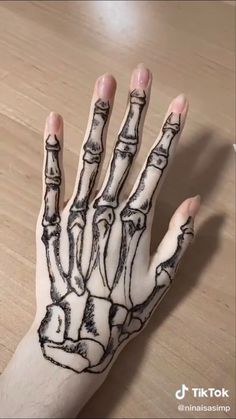 a person's hand with black ink on it