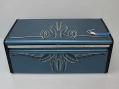 a blue box with an intricate design on it