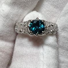 A gorgeous Victorian lace and natural 7mm London Blue Topaz engagement ring. This ring is custom-made and is available in most precious and semi-precious gems as well as all metals. A gorgeous, unique ring.   This ring is available with purple amethyst, citrine, red rubies, blue Topaz, Mystic topaz, green peridot, smoky quartz, white topaz, labradorite, Moonstone, and black spinel for this price. If you're looking for additional precious gem such as Emerald, morganite, Tanzanite and blue sapphir Exquisite Topaz Promise Ring, Exquisite Round Cut Topaz Promise Ring, Turquoise Sapphire Anniversary Ring With Accent Stones, Turquoise Sapphire Ring With Accent Stones For Anniversary, Elegant Round Turquoise Topaz Ring, Elegant Turquoise Topaz Ring, Round Shape, Elegant Turquoise Round Topaz Rings, Exquisite Blue Topaz Ring With Prong Setting, Elegant Filigree Ring With Birthstone For Anniversary