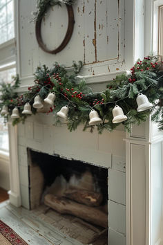 a fireplace decorated with christmas garland and bells