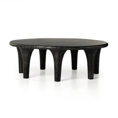 a black table with three legs and a circular top on it's side, against a white background