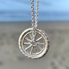 This necklace features singular bicycle wheel spinning on a cable chain. This wheel is made out of sterling silver with tiny little spokes and tire tread. It is a fun and ￼original pendant. I love to ride my bicycle and the feeling of freedom and gives me and celebrate that with this piece of jewelry. This wheel is approximately 3/4 inch in width.￼ Wood Jewelery, Tire Tread, Fort Bragg, Bicycle Wheel, Wooden Necklace, Jade Necklace, Women Christmas, Circle Necklace, Christmas Gifts For Women