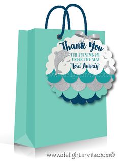 a blue and white bag with the words thank you