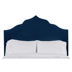 a blue headboard with two white pillows