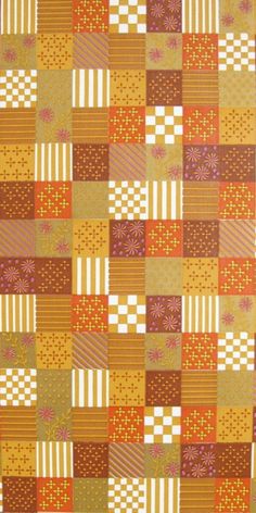 an orange and brown patchwork quilt