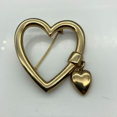 "Vintage Heart Outline Brooch with Small Heart Charm Dangle, Gold Tone 2\" unmarked Condition: Very nice condition. Gently used. Size: Unisex OS Condition: Pre-Owned Good" Vintage Heart Brooch, Heart Outline, Holiday Paper, Vintage Heart, Small Heart, Sell Items, Large Prints, Vintage Metal, Heart Charm