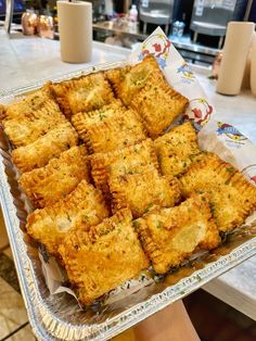 a tray full of fried food sitting on top of a table