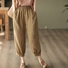 Details: Gender: Women Item Type: Pants Material: Linen Season: Summer Pattern: Solid Style: Casual, Loose, Retro Waist Type: Elastic Waist Size: M Waist: 62.00 - 100.00 cm/ 24.41 - 39.37 " Length: 81.00 cm/ 31.89 " Hip: 120.00 cm/ 47.24 " Thigh: 62.00 cm/ 24.41 " Bottom 36.00 cm/ 14.17 " Size: L Waist: 64.00 - 102.00 cm/ 25.20 - 40.16 " Length: 82.00 cm/ 32.28 " Hip: 122.00 cm/ 48.03 " Thigh: 64.00 cm/ 25.20 " Bottom 38.00 cm/ 14.96 " Spring Brown Bottoms With Pockets, High-waist Cotton Harem Pants In Brown, High Waist Brown Cotton Harem Pants, Spring Brown Wide Leg Pants With Side Pockets, Casual Brown Harem Pants For Spring, Brown Relaxed Fit Harem Pants For Spring, Spring Tapered Leg Harem Pants With Side Pockets, Spring Khaki Harem Pants With Loosely Fitted Hips, Casual Brown Bottoms For Spring