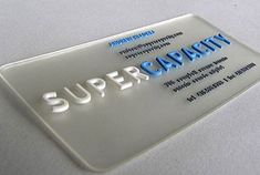 a white and blue business card with the words supercapant on it's side