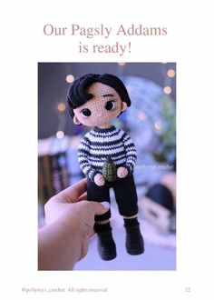 a hand holding a doll with the caption, our pagsly addams is ready