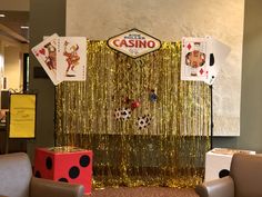 a casino themed room with chairs and decorations