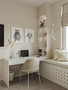 a white desk with a computer on top of it next to a window in a room