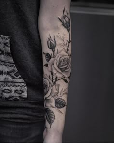 a person with a flower tattoo on their arm