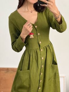 "* 100% soft linen  * V-neck * Long sleeve  * Pockets  * The waist can be adjusted by a linen tie at the back * Handmade in Slovakia   * The model is 5'12\"/ 184 cm tall: -wearing size M, color moss green, standard length - wearing size S, color forest green, standard length  - wearing size S, color beige/white gingham  (altered length + 10 cm/ 4\"),    Measurements in inches/cm: Size XS Recommended body measurements for a fitted look: Bust: 31\"- 32\"/ 78 - 82 cm Waist: 25,5\"- 26,5\"/ 65 - 68 cm Hips: 33\"-34\" / 84 - 87 cm   - cloth (laid on the floor):  Bust: 16\"/ 41 cm  Length (from the neckline to the hem measured from the back): 41,5\"/ 105 cm  Length from shoulder to waistline: 14\"/ 36 cm  ---------------------------  Size S Recommended body measurements for a fitted look: Bust: Fitted Button-up Linen Dress, Green Linen V-neck Dress, Green V-neck Linen Dress, Spring Long Sleeve Linen Dress With Pockets, V-neck Linen Dress With Buttons, Casual V-neck Linen Dress For Fall, Fitted Linen V-neck Dress With Buttons, Fall Linen V-neck Dress, Fitted V-neck Linen Dress With Buttons