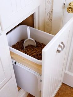 a dog food drawer in the corner of a kitchen