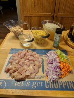 a cutting board topped with chopped vegetables and meat