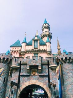 the entrance to sleeping beauty castle at disneyland world