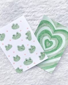 two cards with frog designs on them, one is green and the other is white