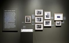 an exhibit with black and white photographs on the wall