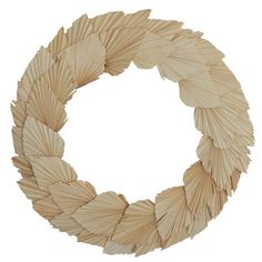 a wooden wreath with large leaves on it's sides and an oval shape in the middle