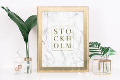 a framed print with the words boss lady in black and gold frame next to a plant