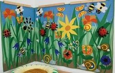 a child's room decorated with colorful flowers and bugs on the wall, along with a dog bed