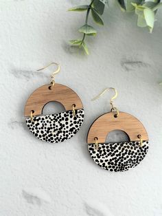 Welcome to love bon bon!  This gorgeous Riley Cork and Leather with cut out half circle wooden topper dangle earring will make a big statement and guaranteed to get compliments!   Super comfortable and lightweight, the earrings are made with Genuine Leather matched with beautiful light timber wooden topper backed with gold stainless steel earring post - the earrings are hypoallergenic and safe for sensitive ears Size: approximately 5.5cm (55mm) from top to bottom including the gold plated earring hook Please note that each pair of earring will differ slightly from the photo due to the leather pattern and photo lighting Each and every love bon bon earrings are lovingly hand-crafted and made to order We hope you enjoy our earrings as much as we love making them. We are here to help, if for a Earrings Aesthetic, Earring Handmade, Handmade Earring, Earring Post, Bon Bon, Half Circle, Leather Pattern, Big Earrings, Stainless Steel Earrings