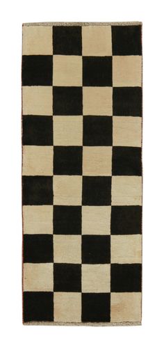 a black and white rug with squares on it