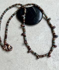 boho necklace with blue and brown small glass seed beads * very small Japanese Miyuki glass seed beads - 8/0 - 3mm * brown and blue colors - both matte and glossy * 11 Miyuki glass drop beads - matte brown - 3x5mm * antiqued copper plated lobster clasp * total length from end to end - 16" * you can enter my shop here:    gypsydangles.etsy.com Brown Beaded Necklaces With Tiny Beads, Brown Beaded Necklace With Colorful Oval Beads, Brown Beaded Necklace With Tiny Round Beads, Brown Tiny Beads Necklace For Gift, Brown Glass Beaded Necklaces With Colorful Beads, Brown Glass Beaded Necklace With Colorful Beads, Brown Czech Glass Beaded Necklaces With Round Beads, Brown Copper Beaded Necklaces With Round Beads, Brown Copper Beaded Necklace With Round Beads