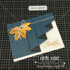 a close up of a greeting card with an autumn leaf on it and the words thank you