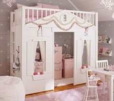 a child's bedroom with a white bunk bed and pink furniture