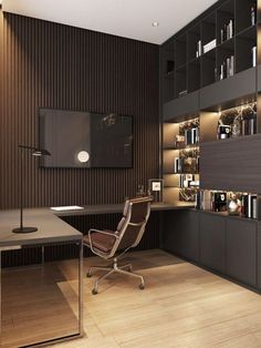 a room with a desk, chair and bookcases on the wall next to it