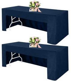 two tables with blue covers and flowers on them