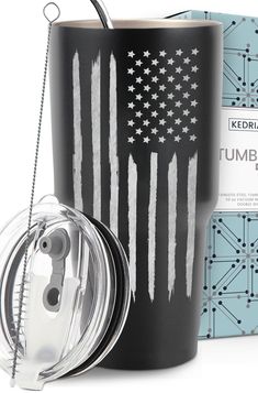 the tumbler cup has an american flag painted on it and is next to its box