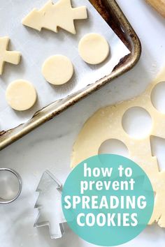 how to prevent spreading cookies on a baking sheet with cookie cutters next to it