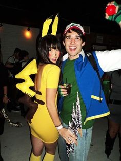 two people dressed up as pokemon and pikachu pose for a photo at an event