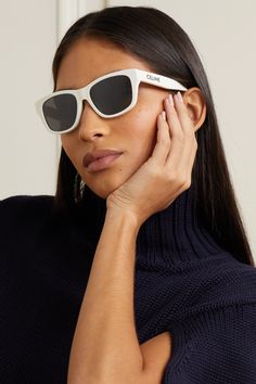 CELINE Eyewear's sunglasses have earned their cult status and this pair is sure to maintain that legacy. Part of the label's 'Monochroms' capsule, they're made from ivory acetate and minimally detailed, save for the brand's emblem. The square frames are eternally classic. Classic White Sunglasses With Tinted Lenses, Luxury White Wayfarer Sunglasses, White Frame Sunglasses, Celine Eyewear, Dark Sunglasses, Celine Sunglasses, White Sunglasses, Acetate Sunglasses, Eyewear Womens